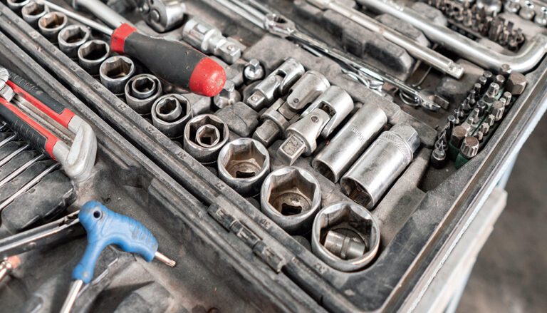 photo of a tool box focusing on large and small nuts and bolts.